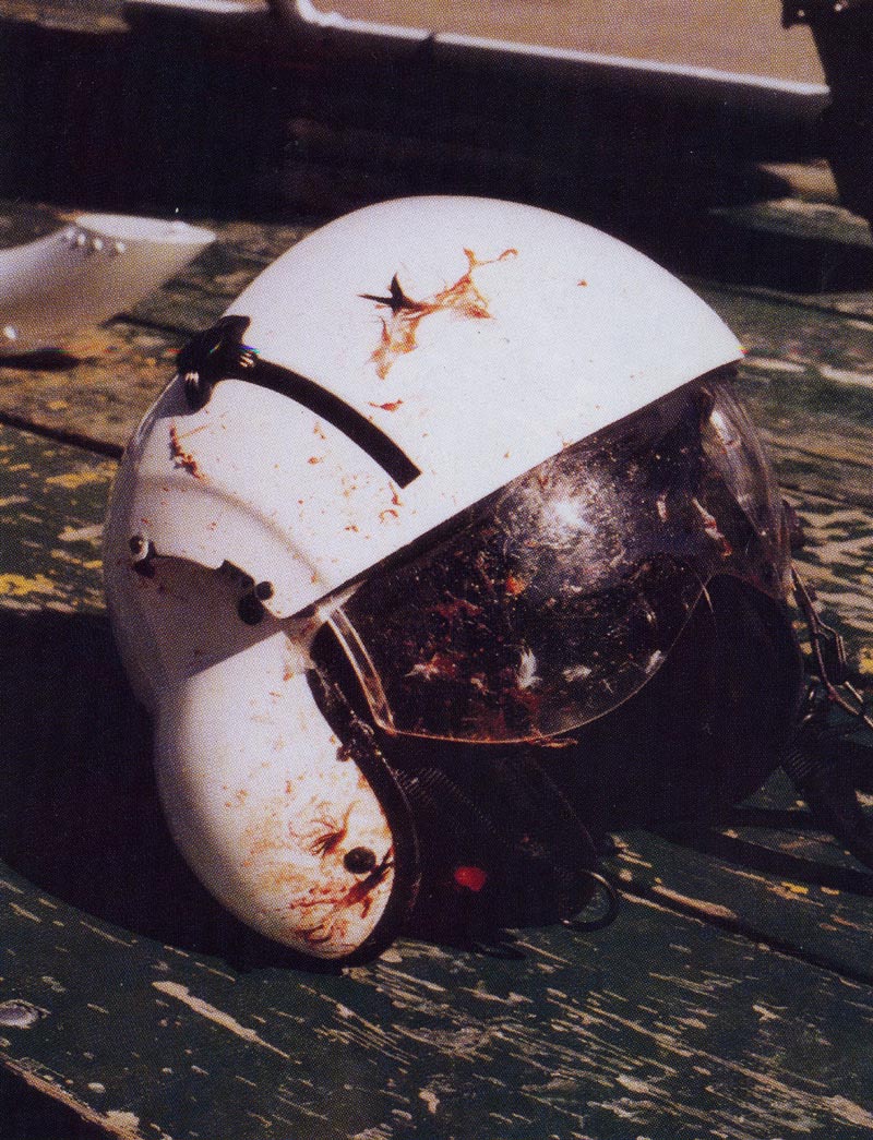 14. Plate 7. The helmet and face-shield probably saved the life of the pilot when he was struck in the face by windshield and bird debris. Photo courtesy Transport Canada.